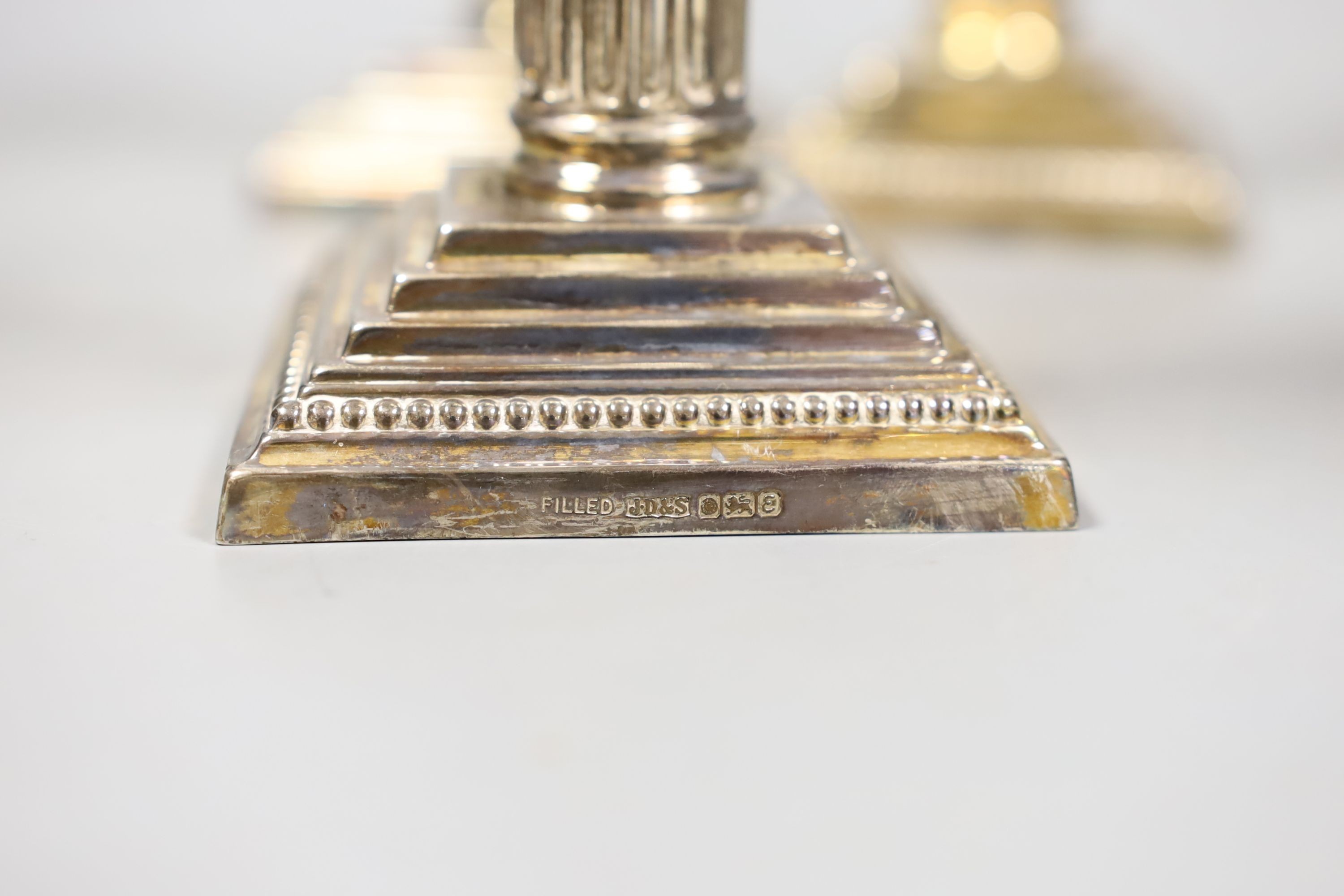 A set of four modern silver Corinthian column dwarf candlesticks, James Dixon & Sons, Sheffield, 1972, weighted, 14.5cm.